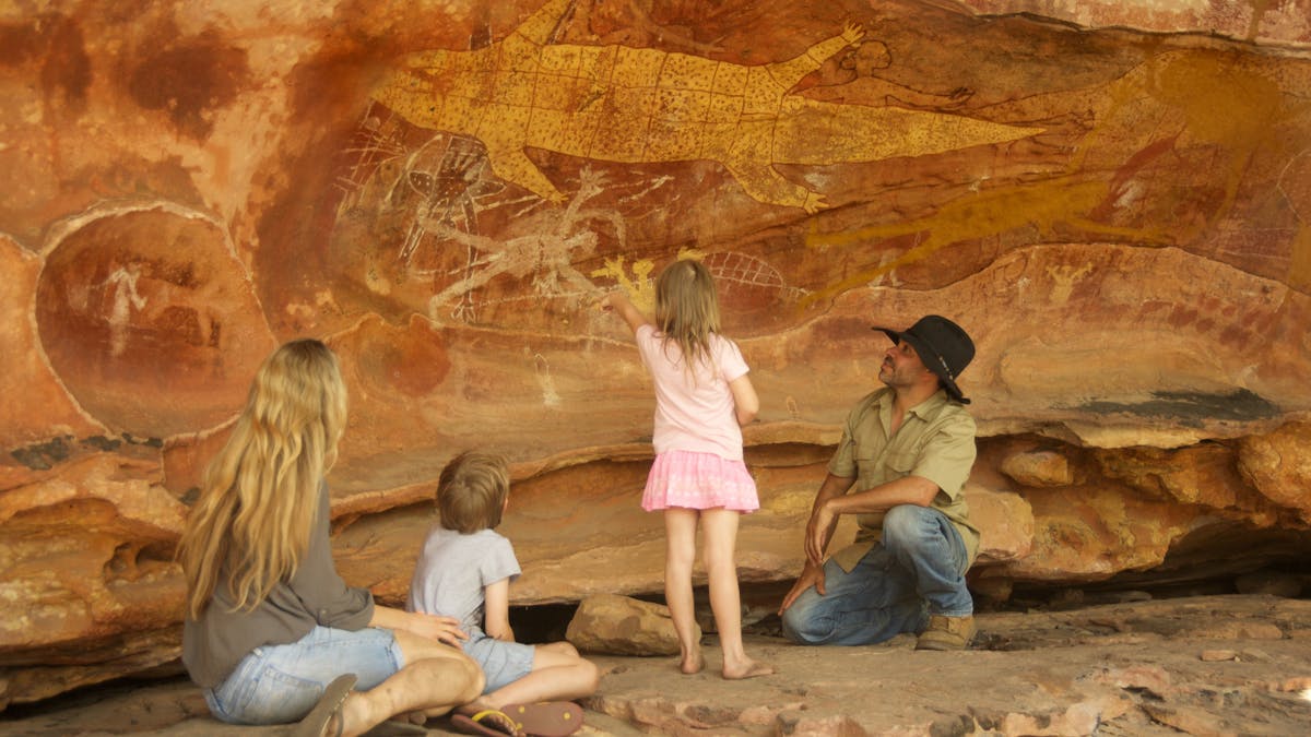 Family fascinated by the art work