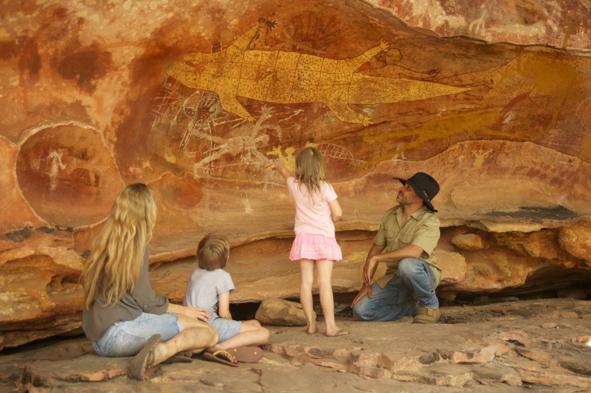 Family fascinated by the art work