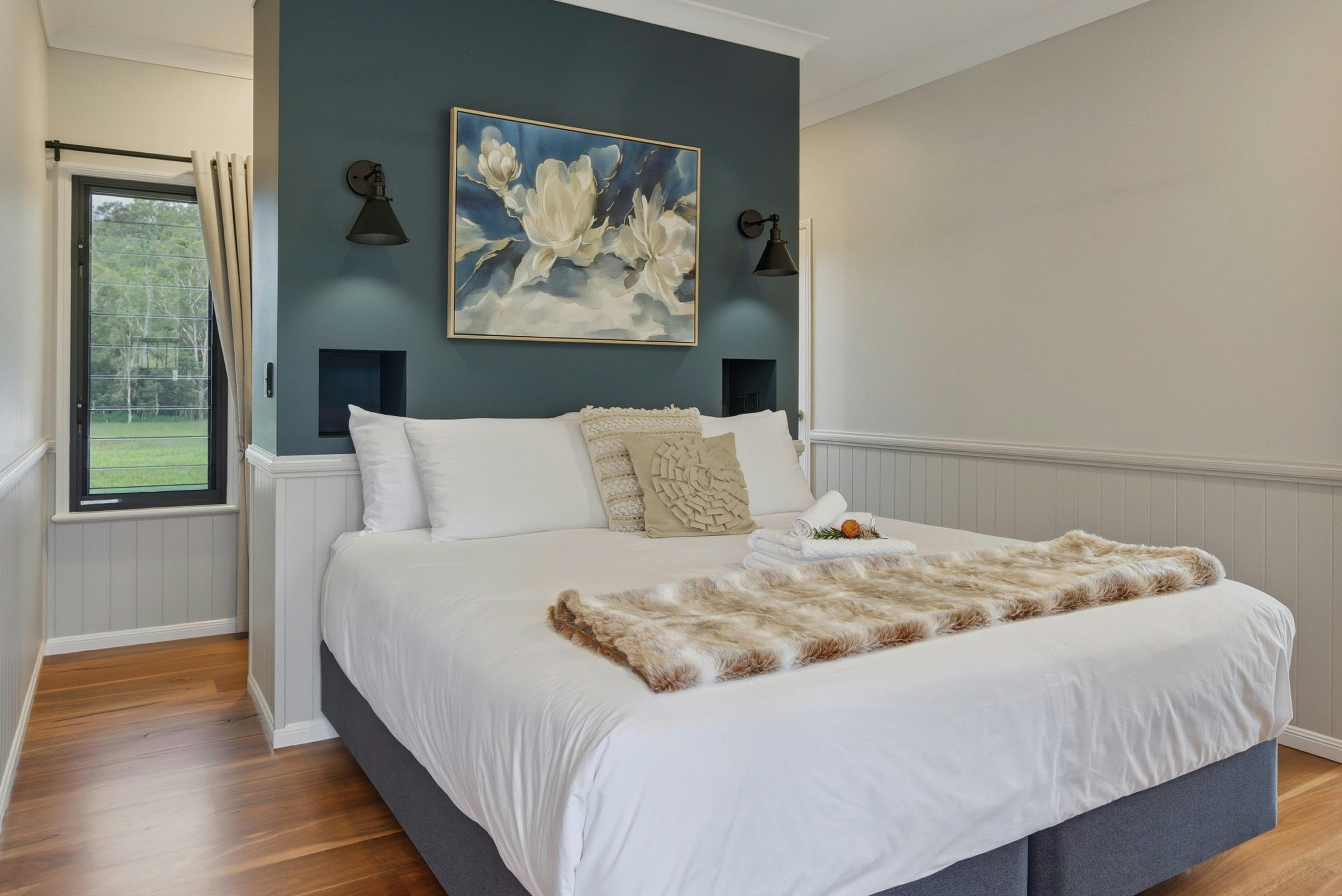 Maleny Lodge master bedroom with king bed and calm, stylish interior