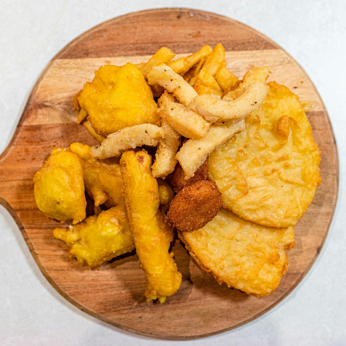 Deep fried seafood on a wooden board