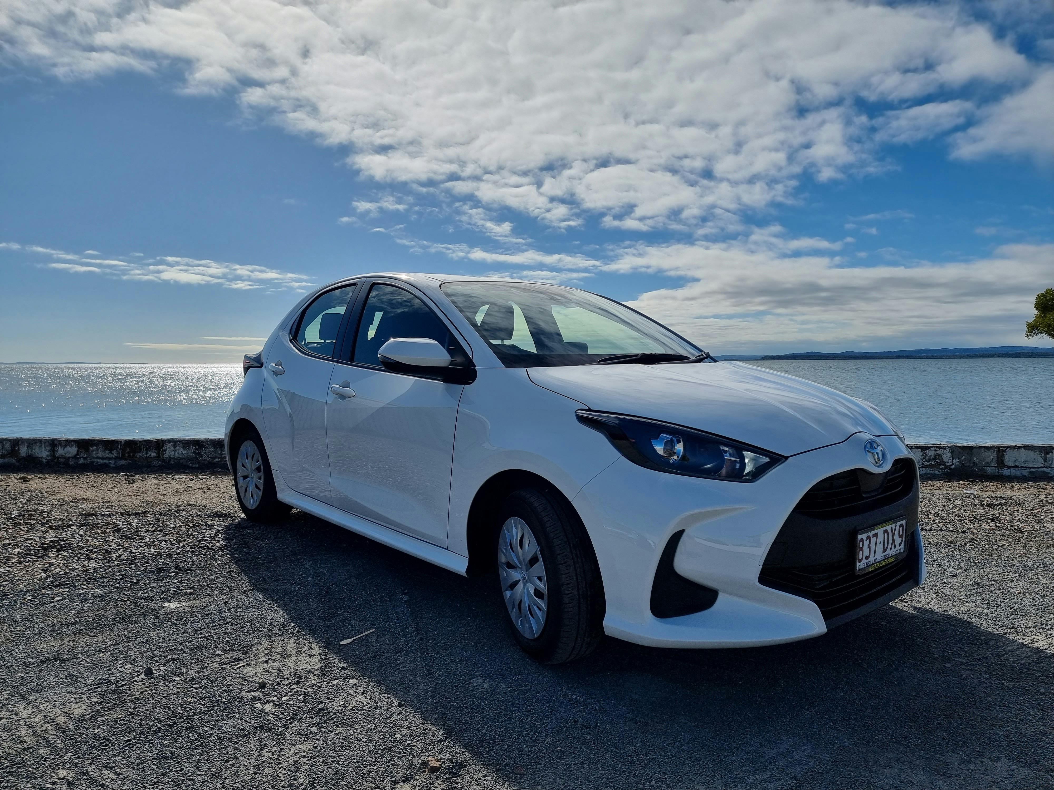 The Toyota Yaris are a small car, perfect for the city where they fit in those parking spots.