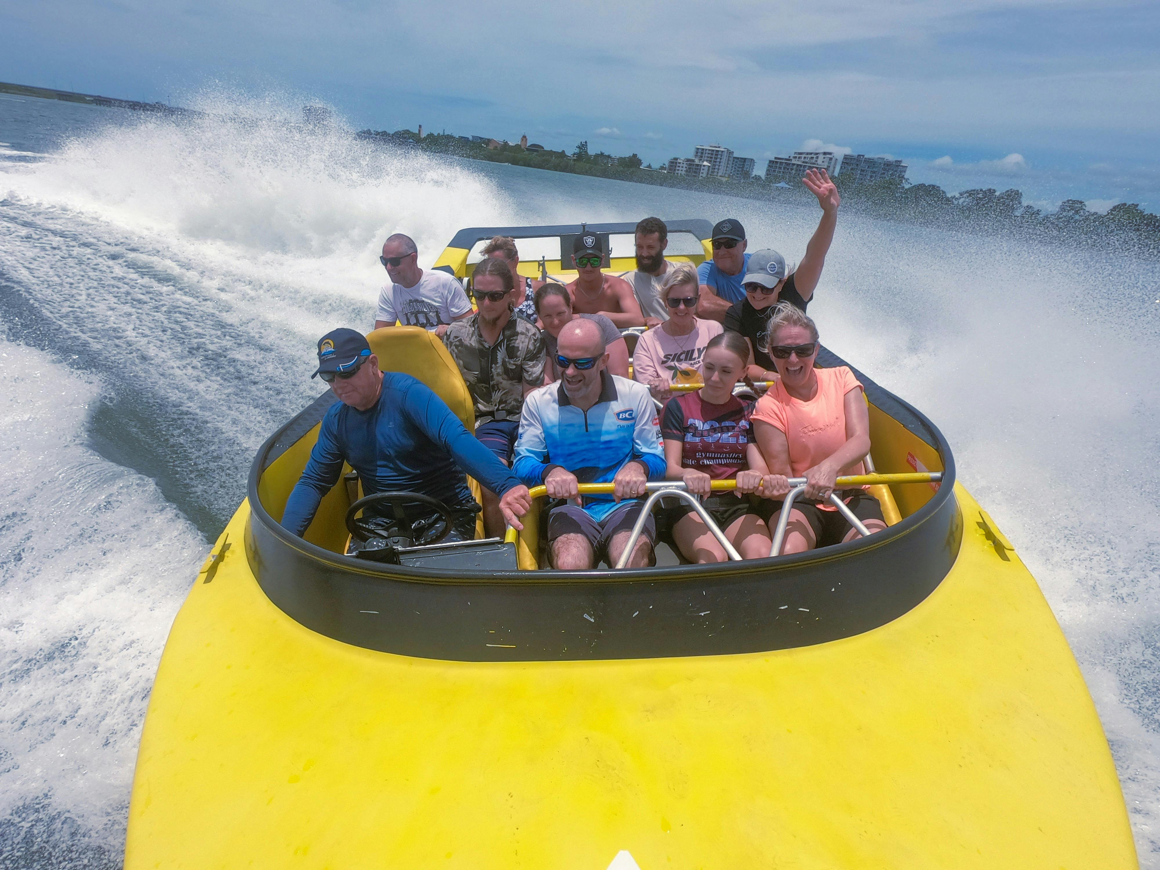 Passengers enjoying jet boat ride
