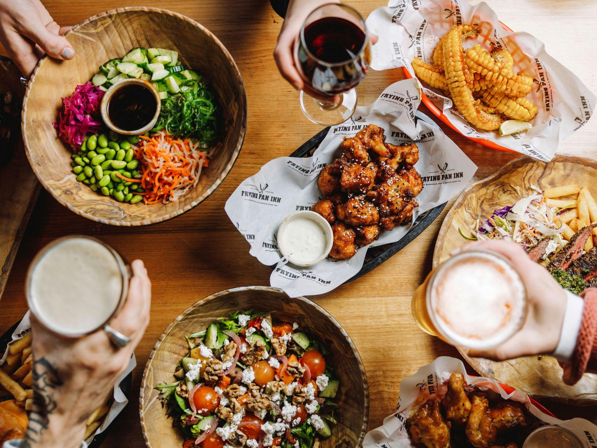 An image of a spread of food on the table at Frying Pan Inn