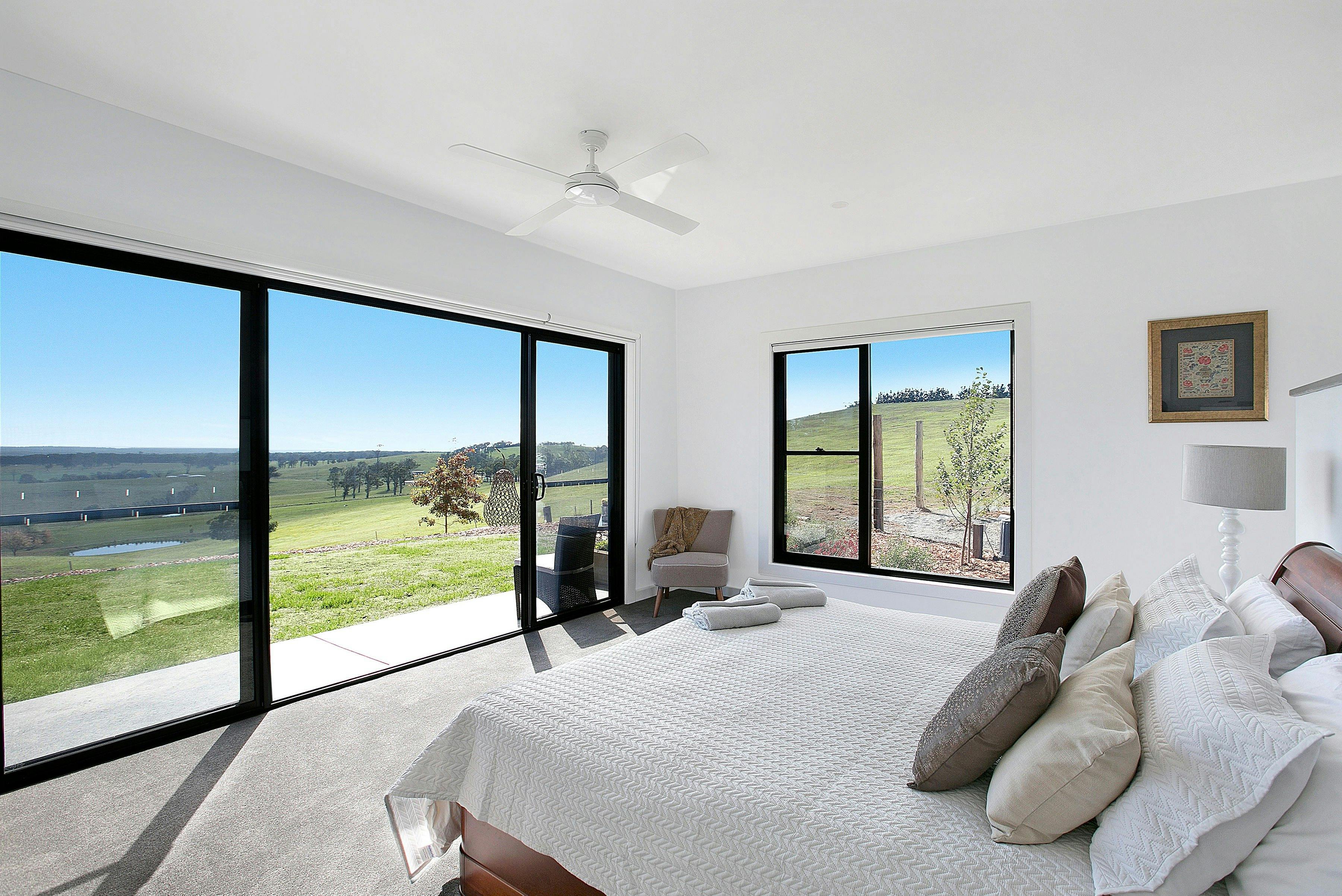 Master suit overlooking the paddocks with the Blue Mountains in the distance