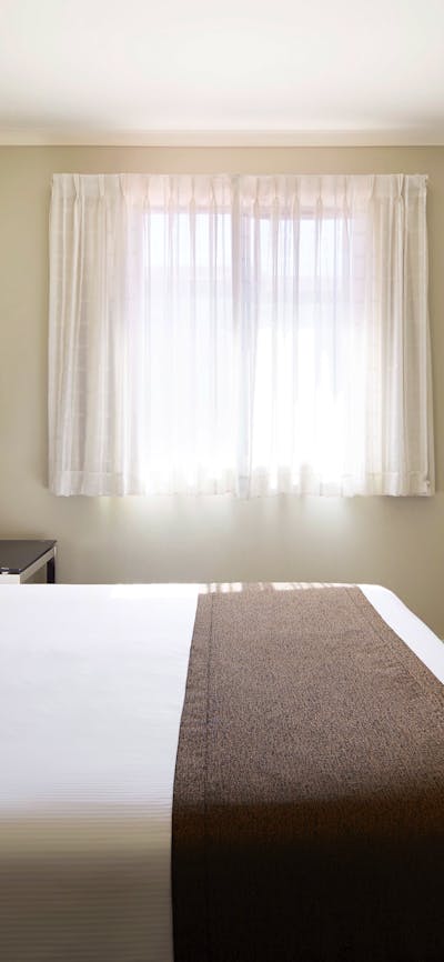 Room with a queen bed