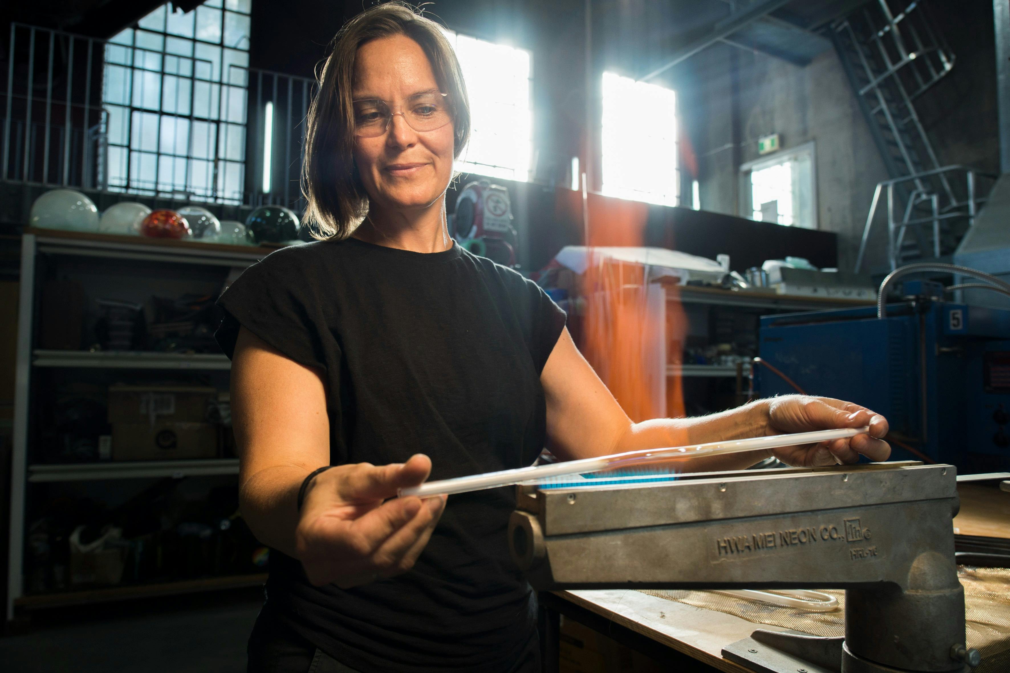 Neon Glass Artist bending glass