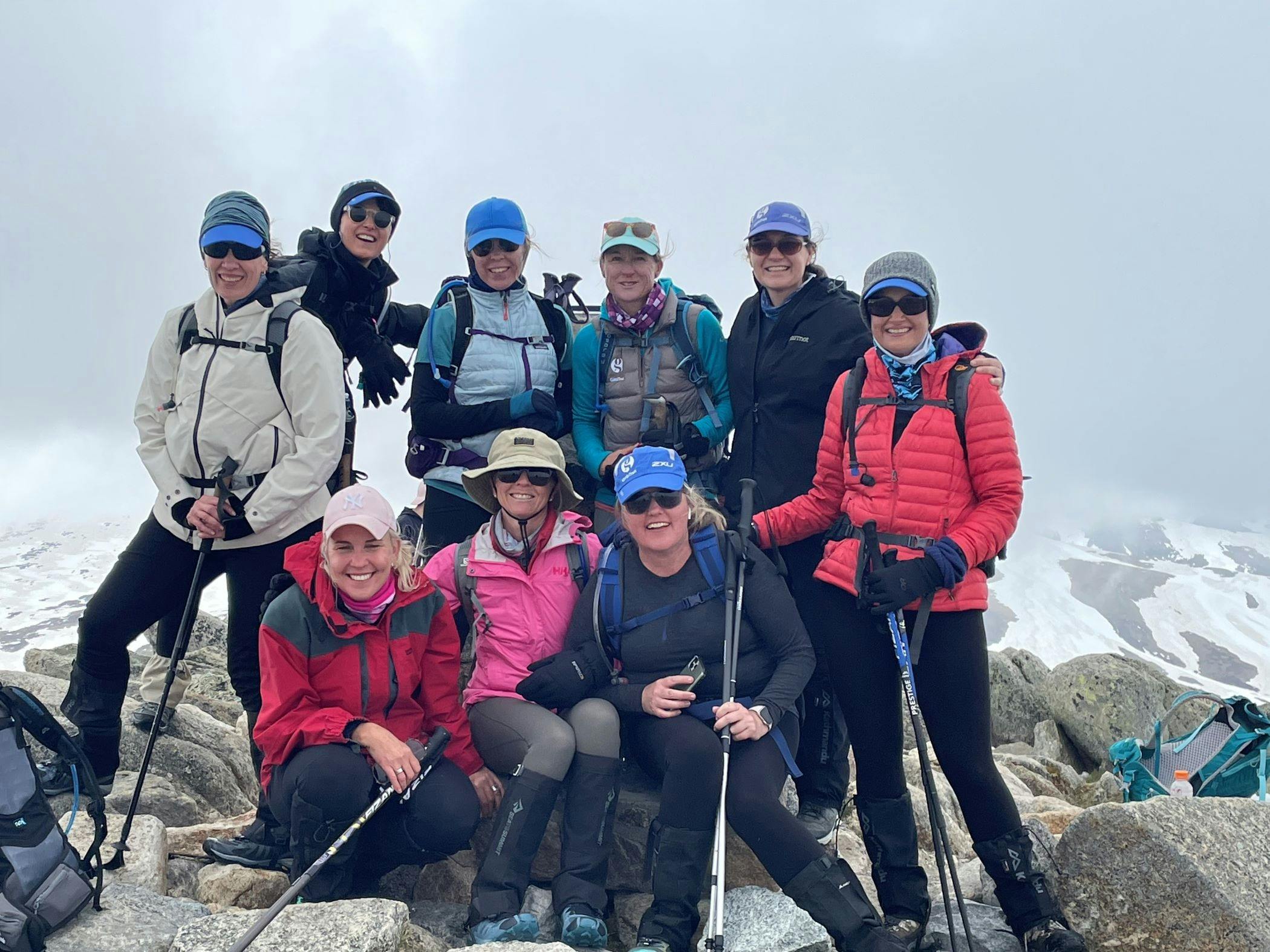 Group gatheres on top of Australia's highest mountain