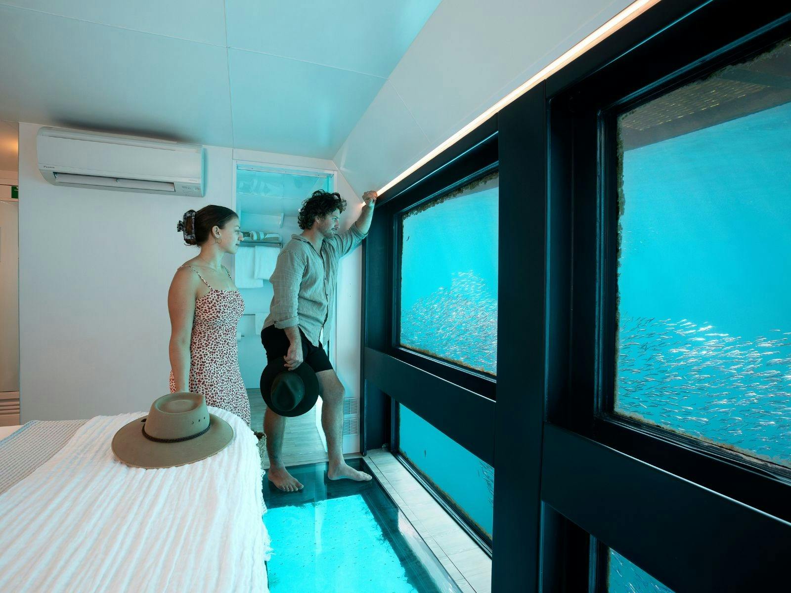 A couple in an underwater room