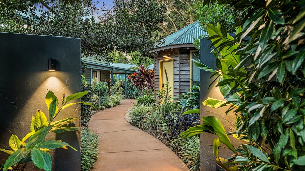 A pathway leading thorugh tropical gardens into Jandar Retreat