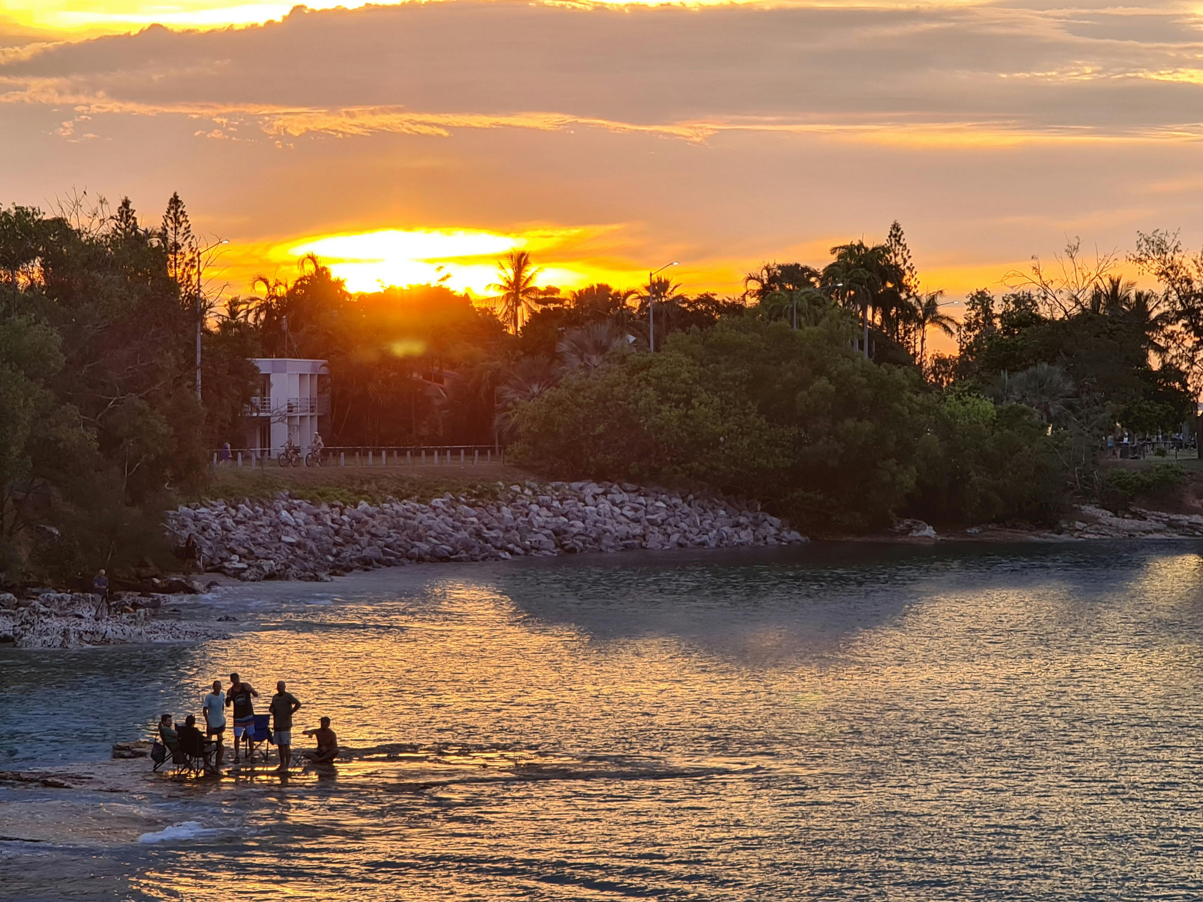 Sunset with people on sandbar