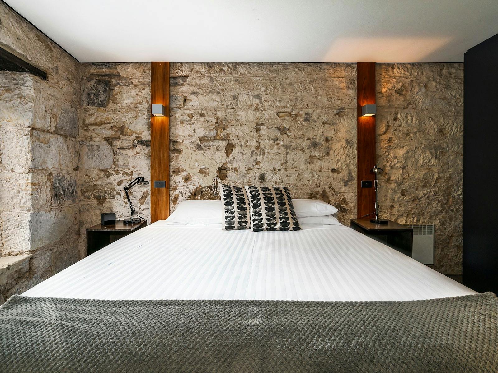 Stunning modern bedrooms in an historic convict sandstone Salamanca Place building.