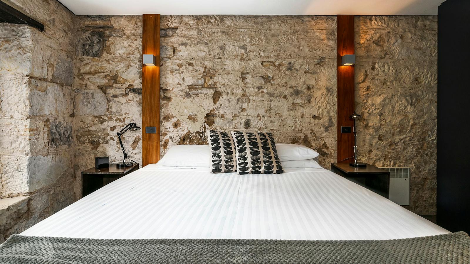 Stunning modern bedrooms in an historic convict sandstone Salamanca Place building.
