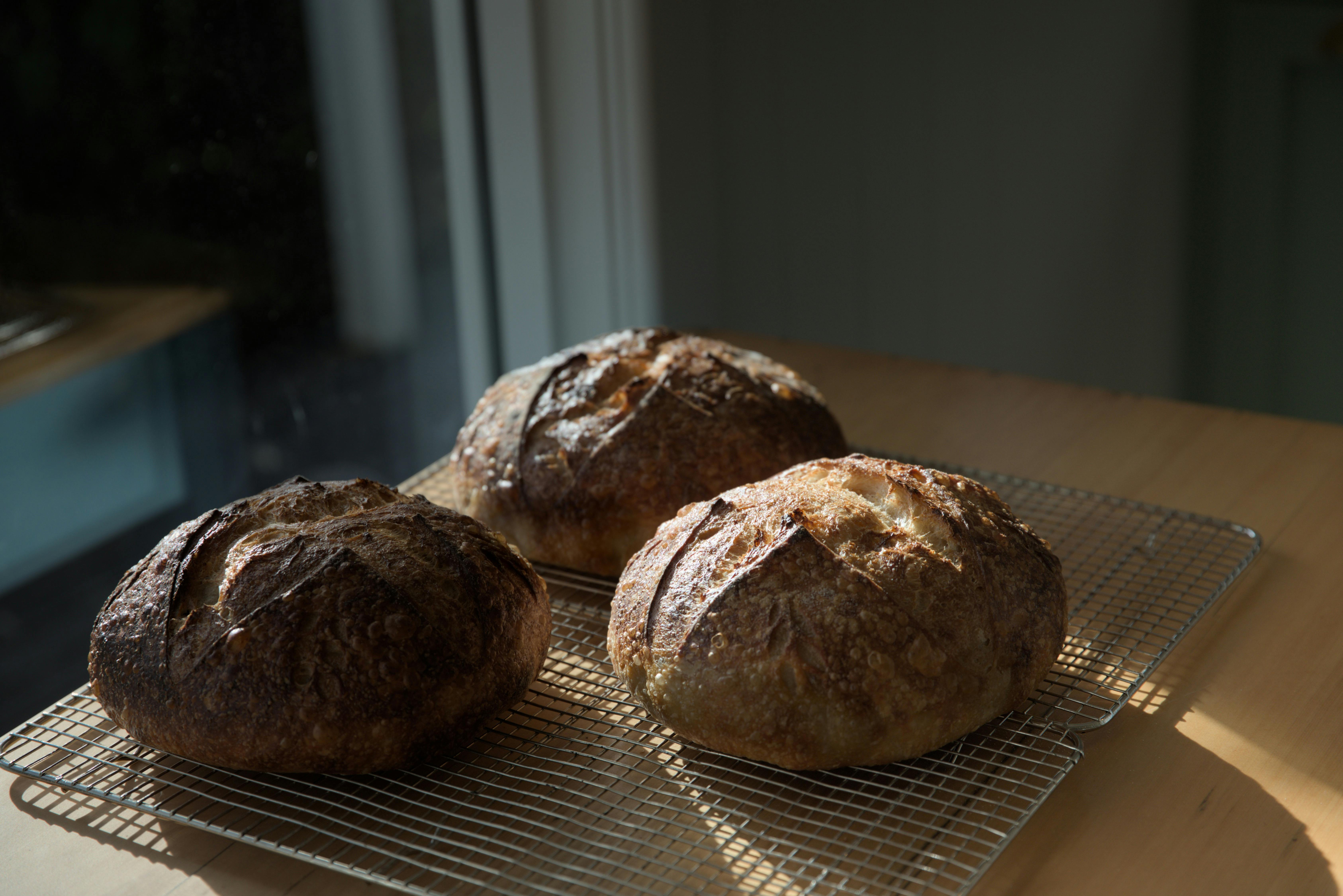 Freshly baked sourdough loaves cooling at Florian Cottage in the Huon Valley.