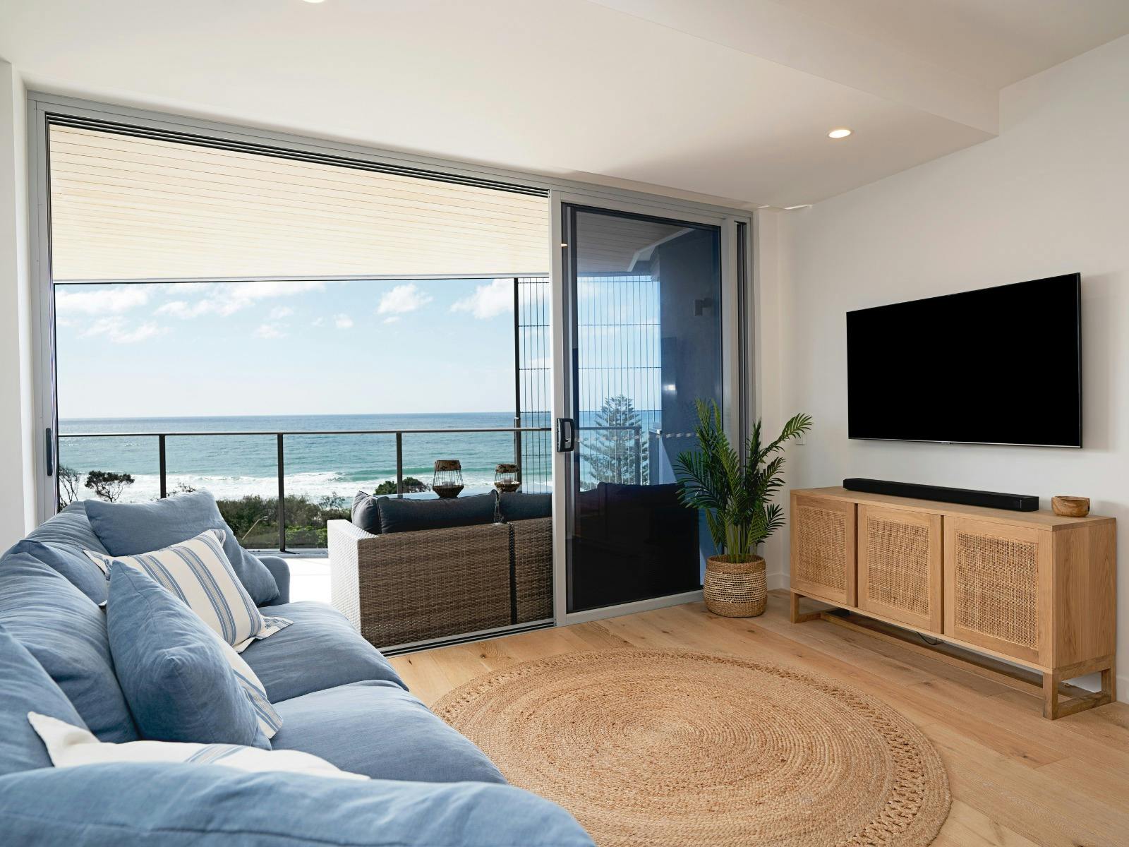 Open plan living area with balcony access