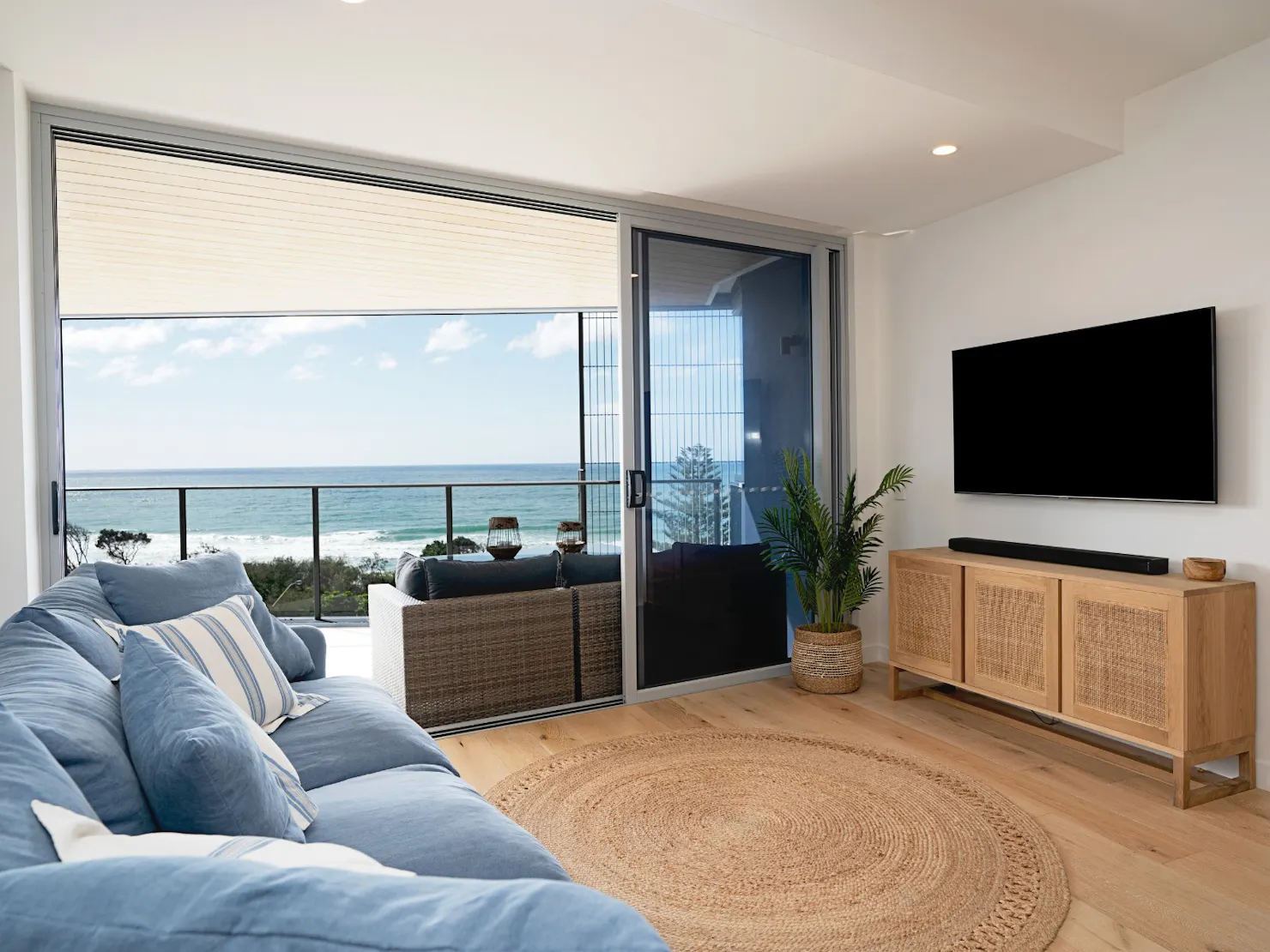 Open plan living area with balcony access