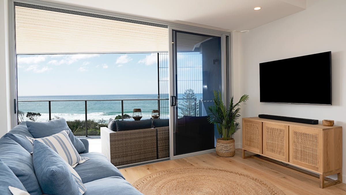 Open plan living area with balcony access