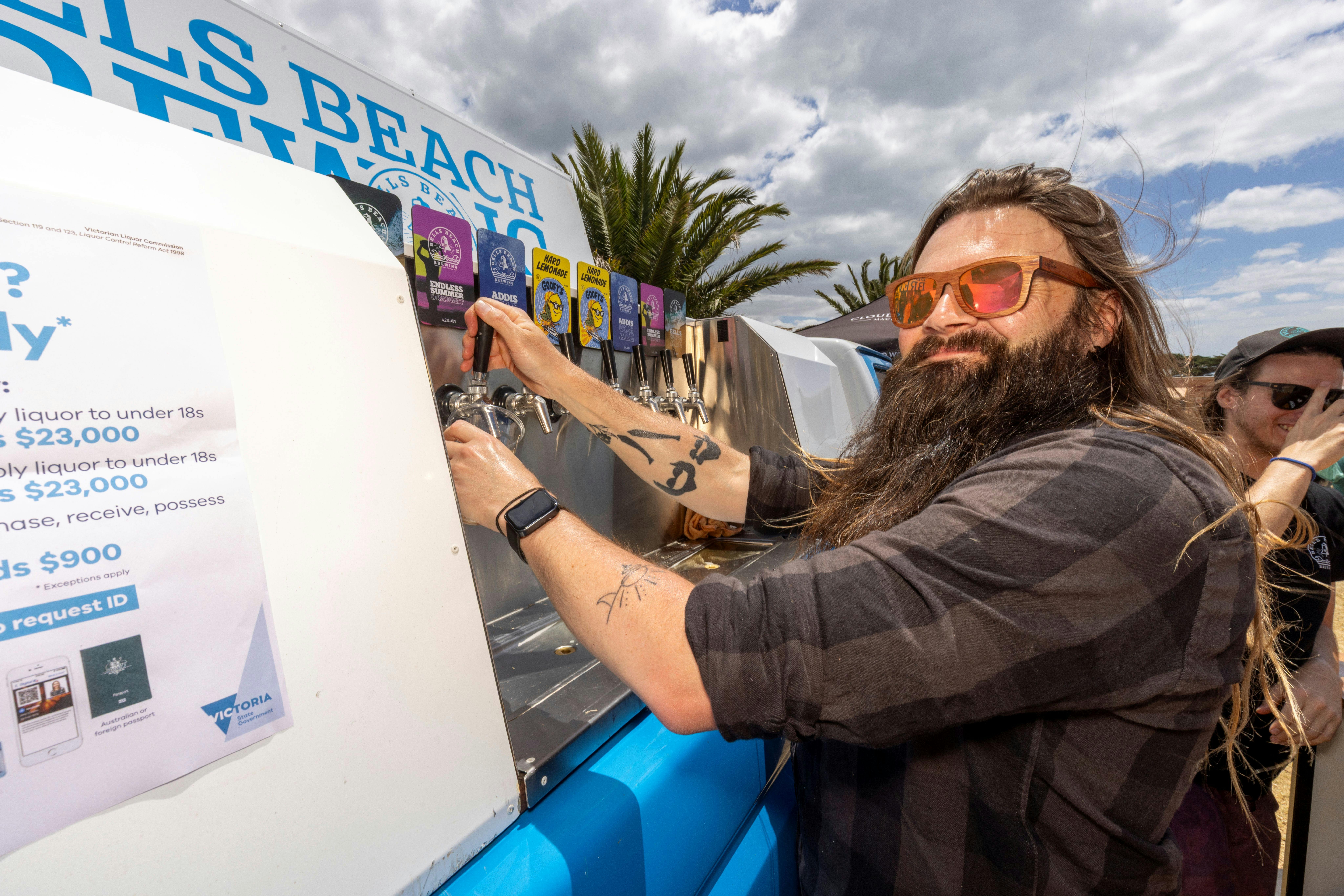 Man pouring local beers at Portarlington Mussel Festival