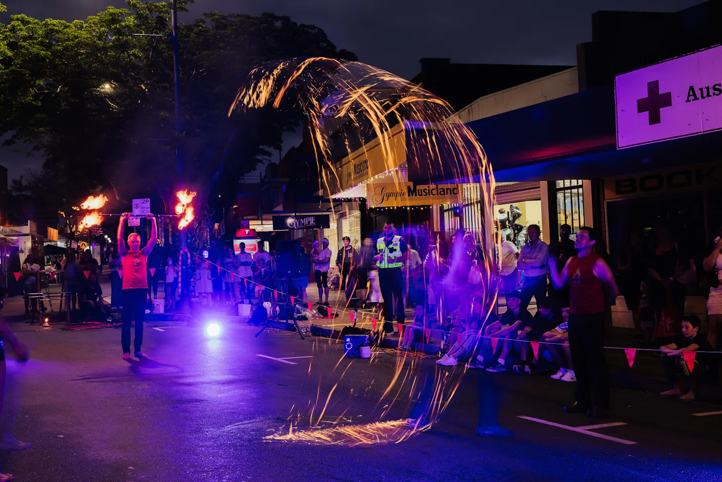 Fire twirler in Mary Street