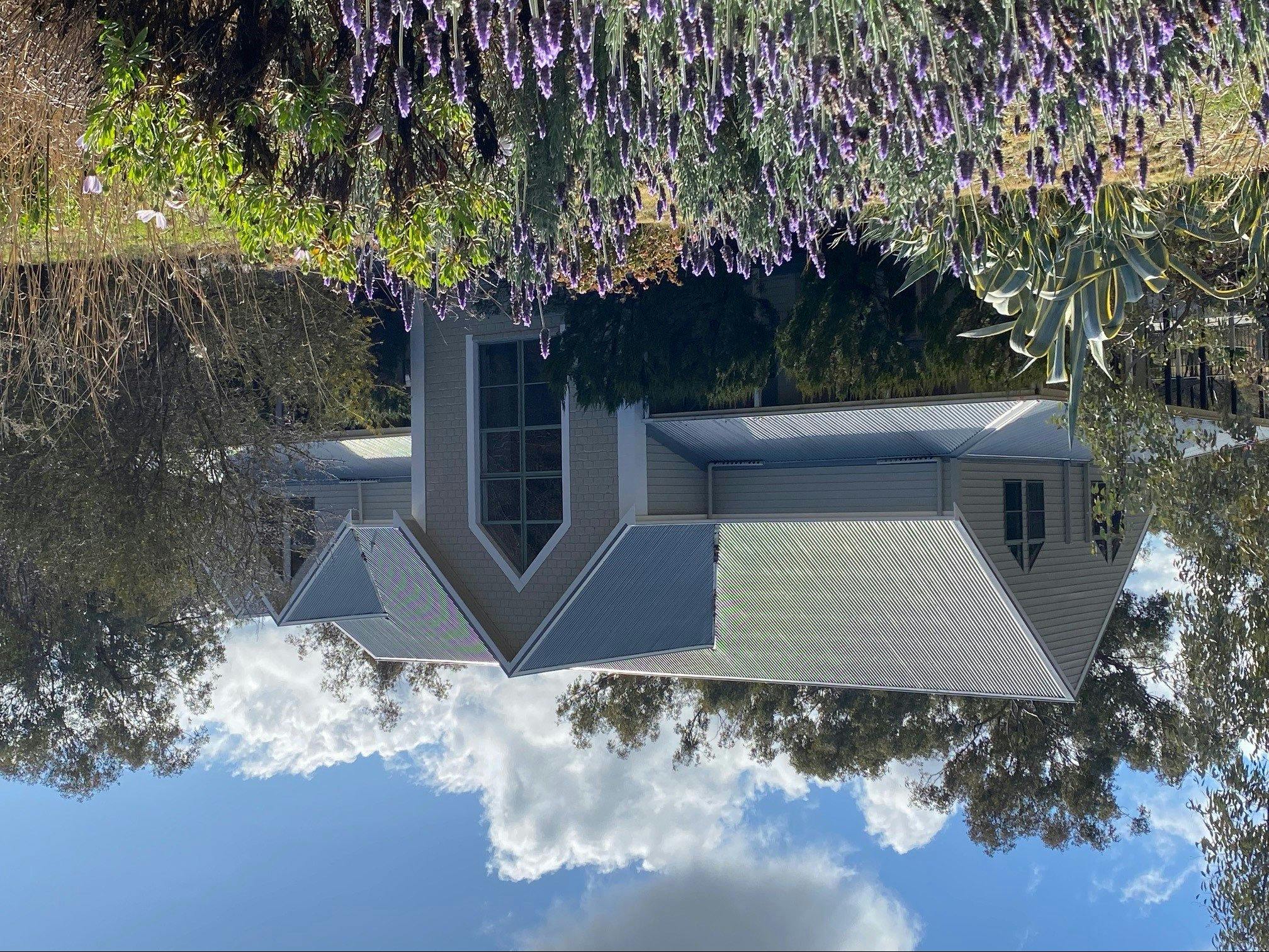 View of the house as your drive down the driveway.