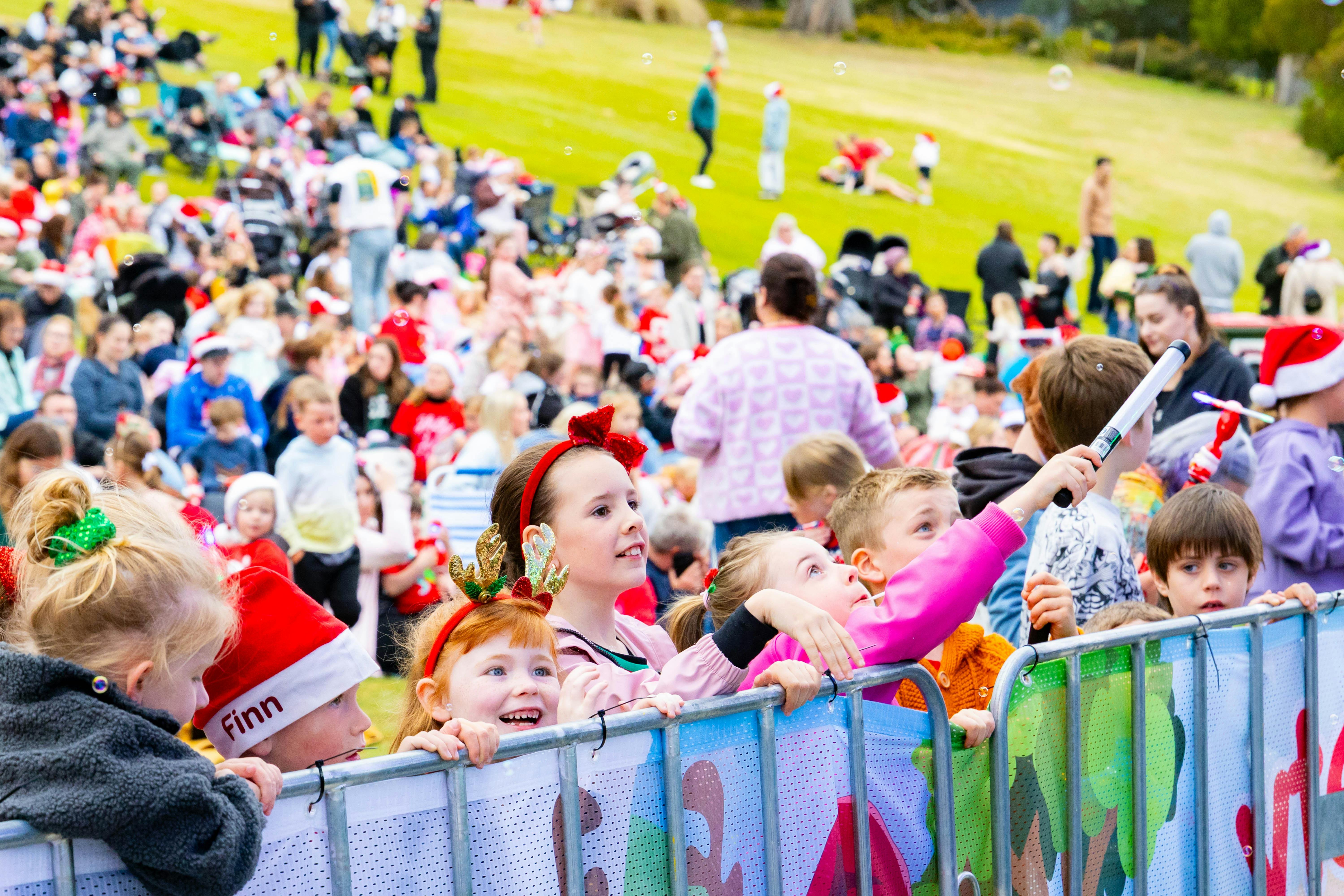 Kids in the audience enjoying the performance of carols at Variety Kids Carols