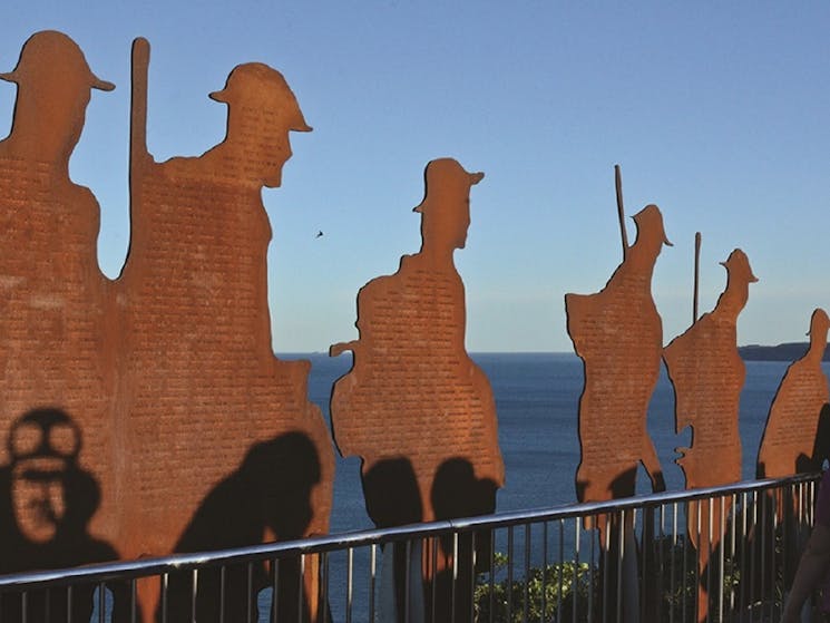 Sculptures of soldiers at ocean lookout