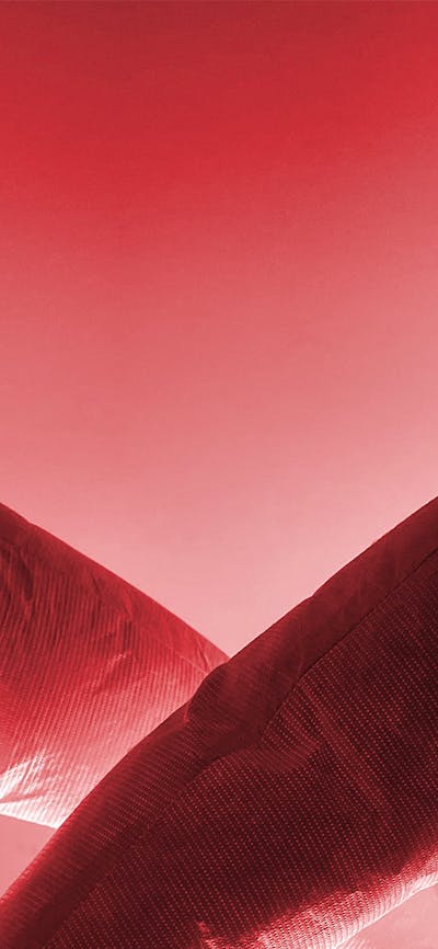 Red image of 2 soft sculptures which look like human figures