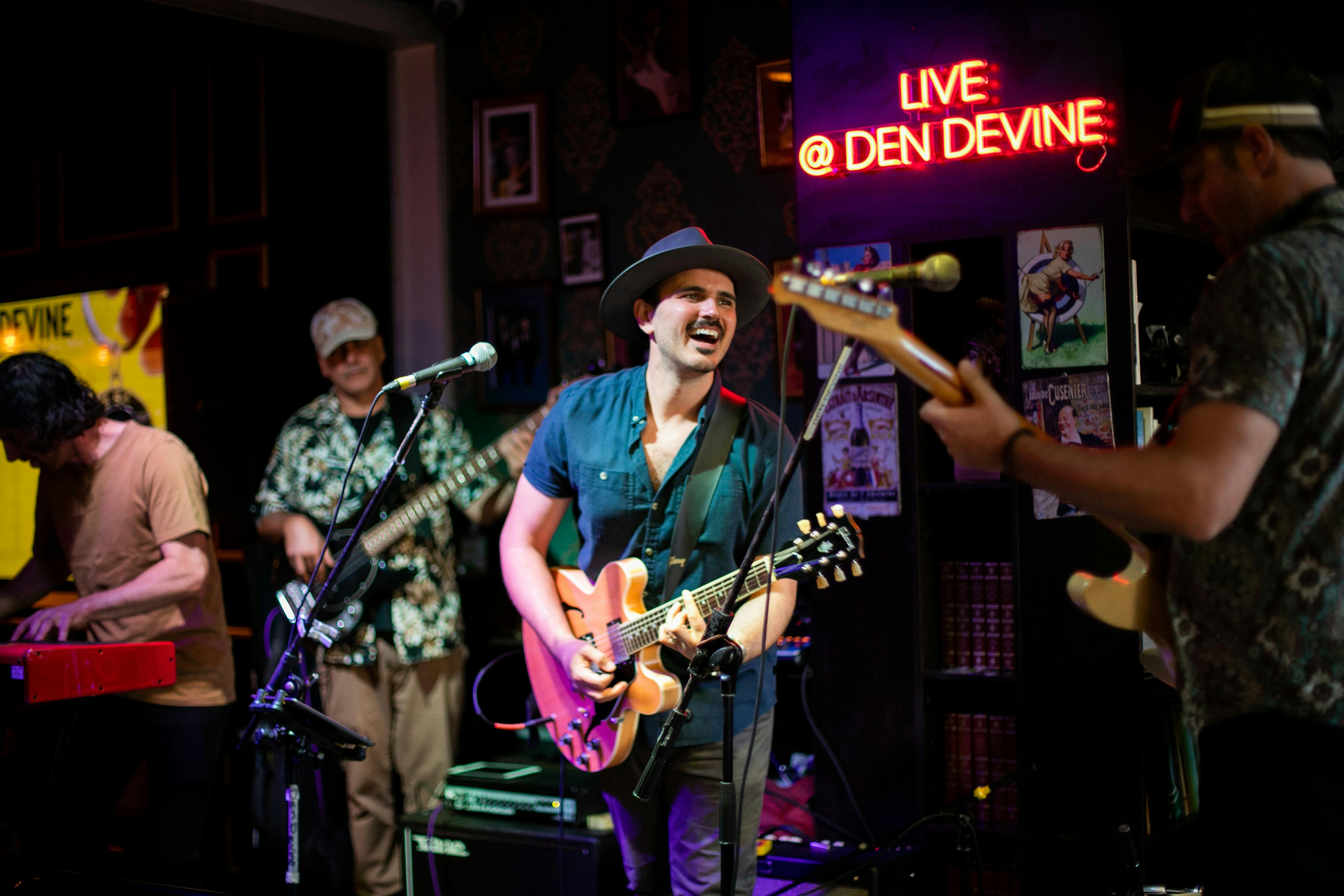 Den Devine's electrifying stage sets the scene for legendary live music, rocking 6 nights a week!