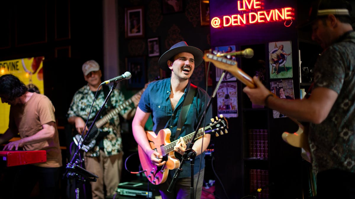 Den Devine's electrifying stage sets the scene for legendary live music, rocking 6 nights a week!