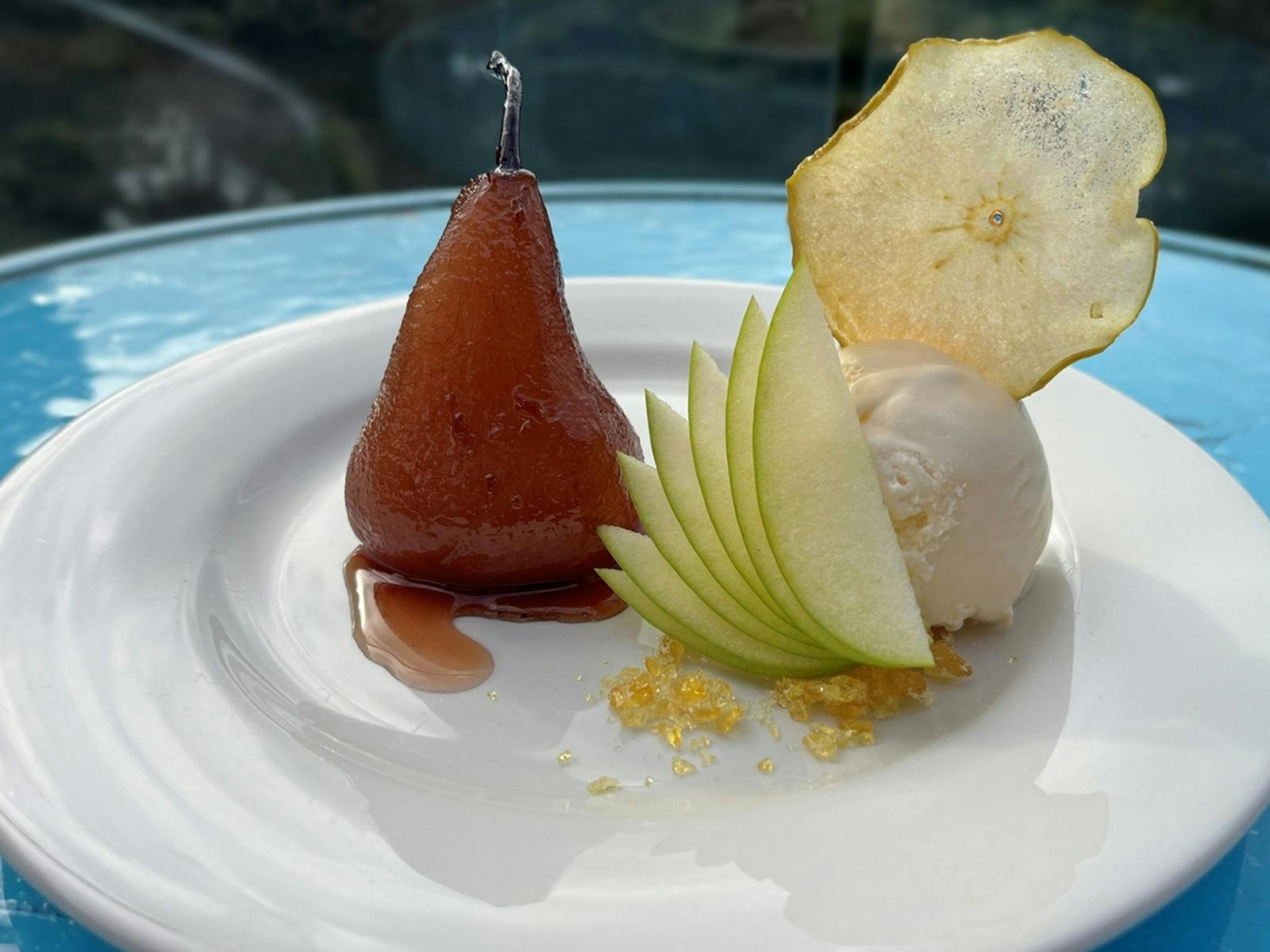 Poached pear in red wine with vanilla bean ice cream