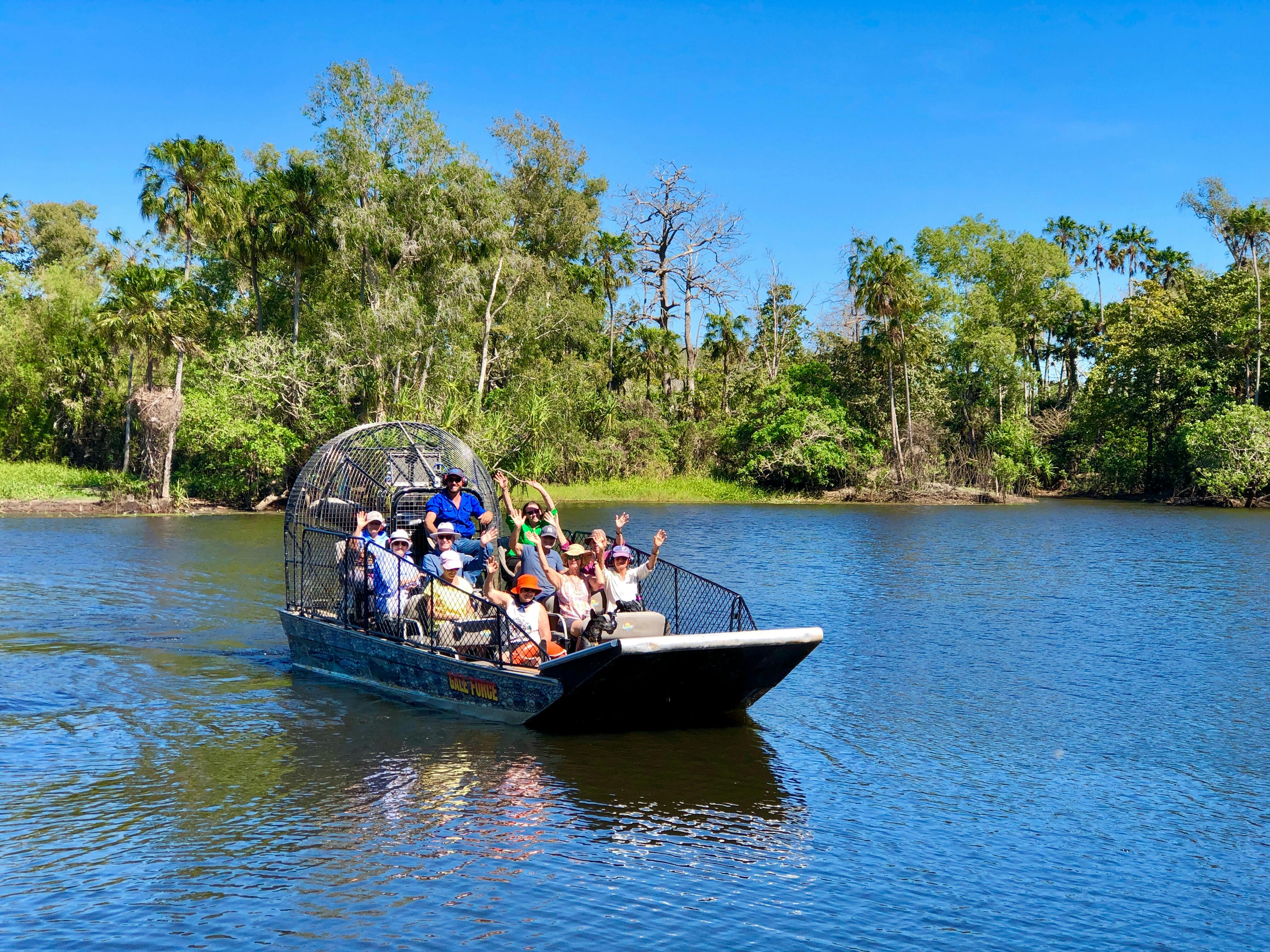 people on airboat cheering