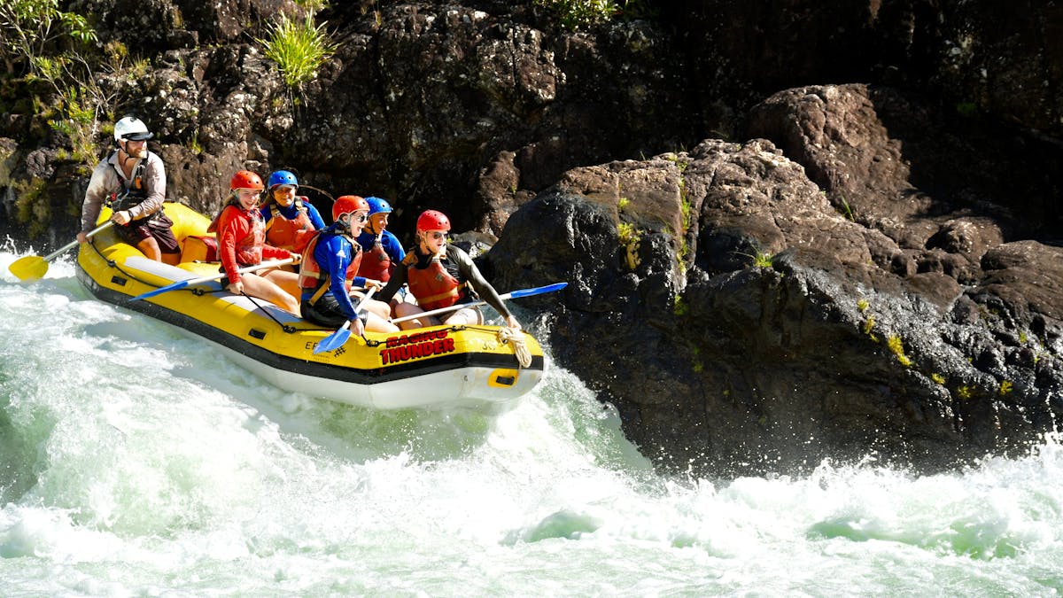 Group of Rafters approaching a rapid on the Tully Gorge National Park River on Cassowary Coast