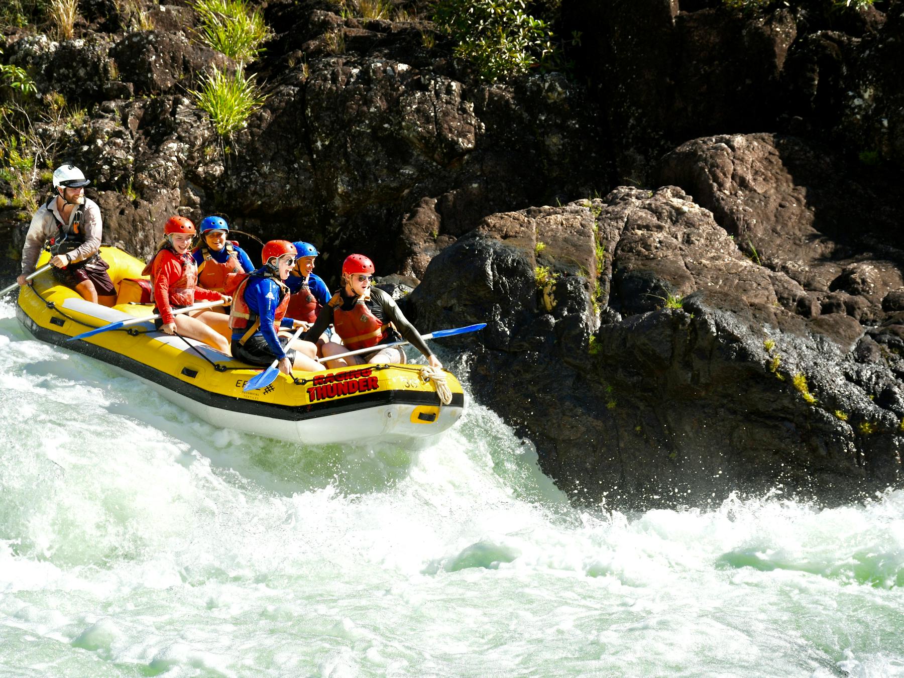 Group of Rafters approaching a rapid on the Tully Gorge National Park River on Cassowary Coast