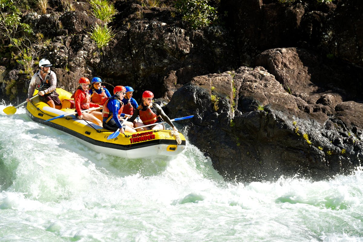 Group of Rafters approaching a rapid on the Tully Gorge National Park River on Cassowary Coast