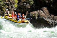 Group of Rafters approaching a rapid on the Tully Gorge National Park River on Cassowary Coast