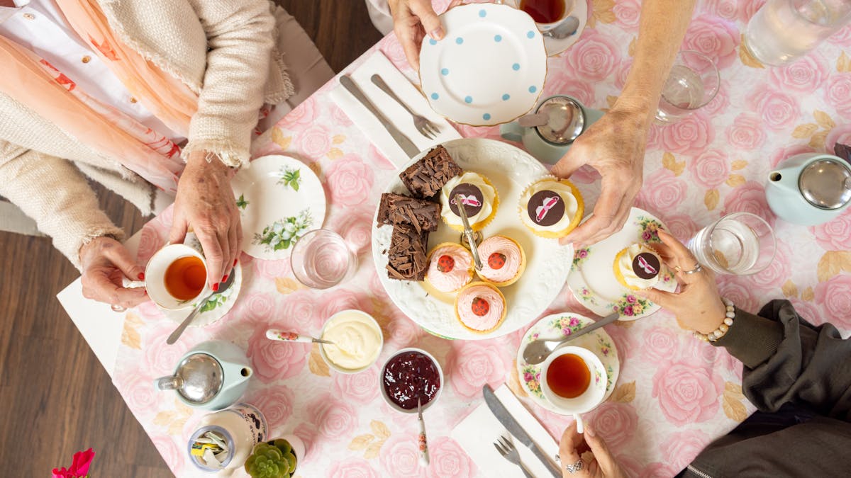 High Tea set out on a table with pink rose table cloths
