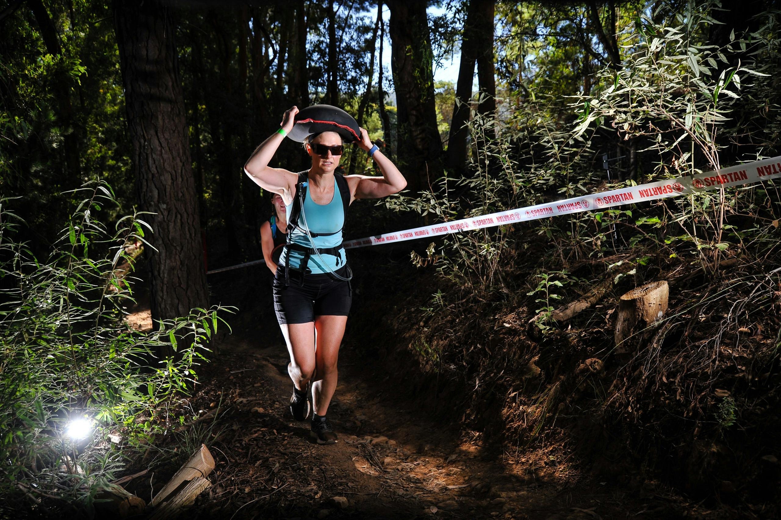 A person competes in Spartan Race.