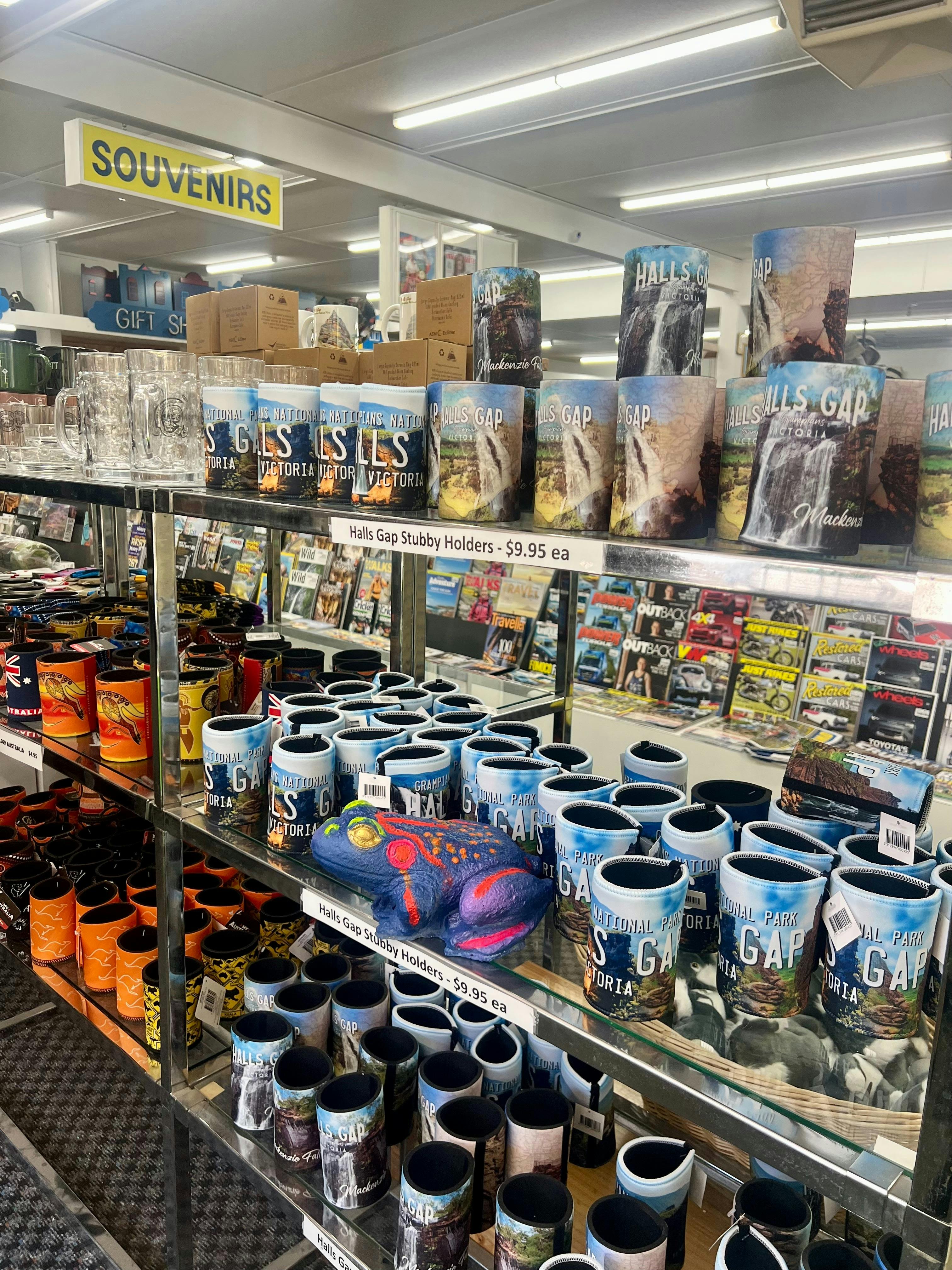 Brightly painted plaster frog on  a shelf