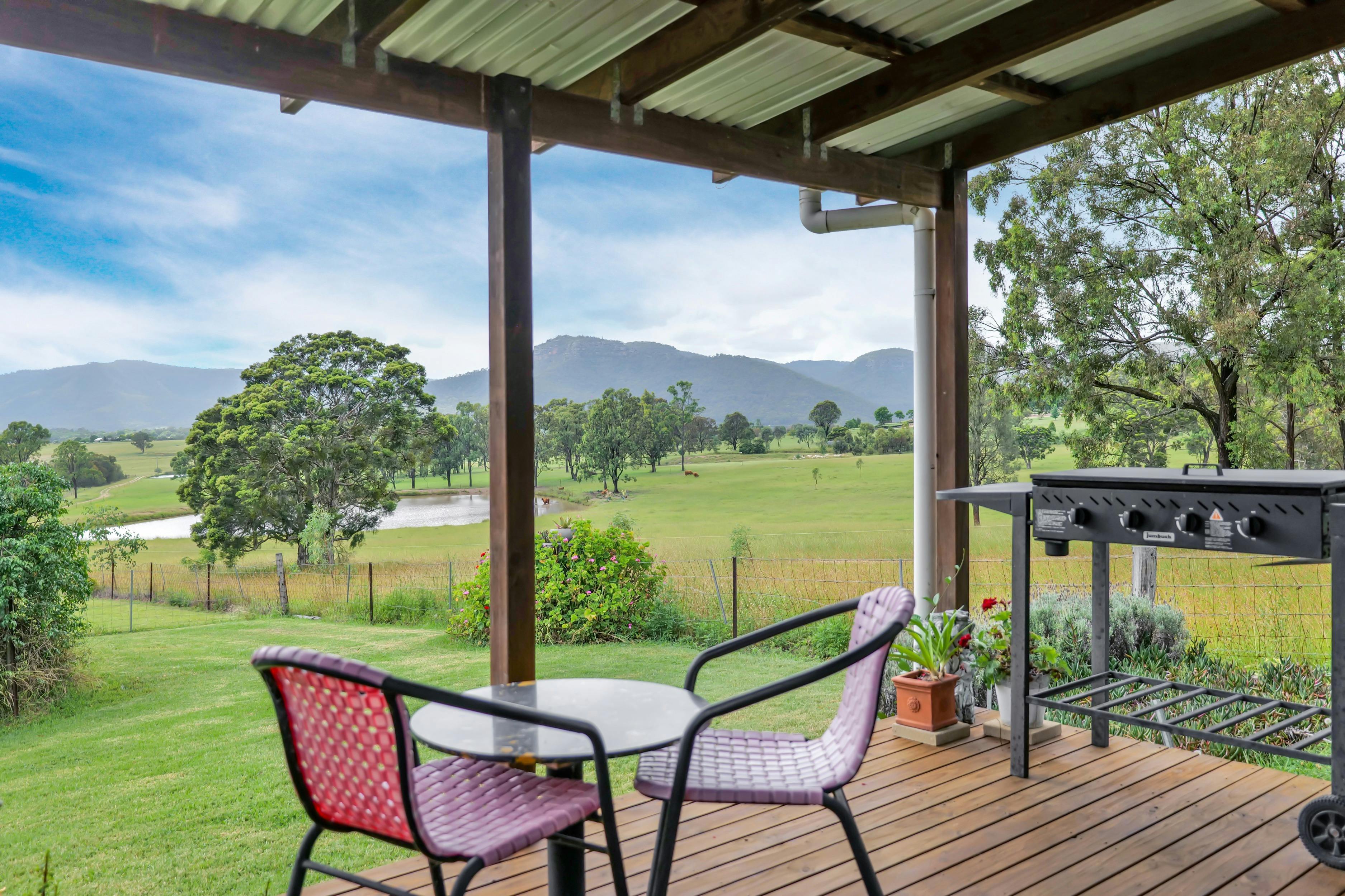 View across paddocks to "Yellow Rock" Mountains from Gardeners Cottage