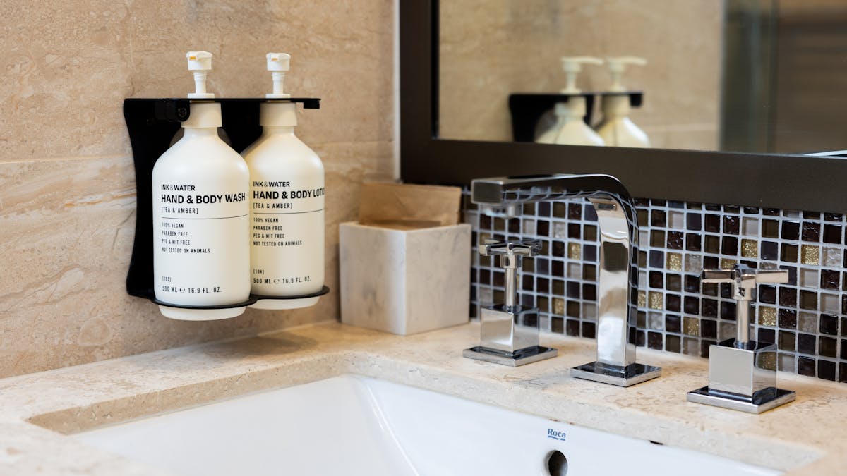 Bathroom with walk in shower and Ink & Water amenities