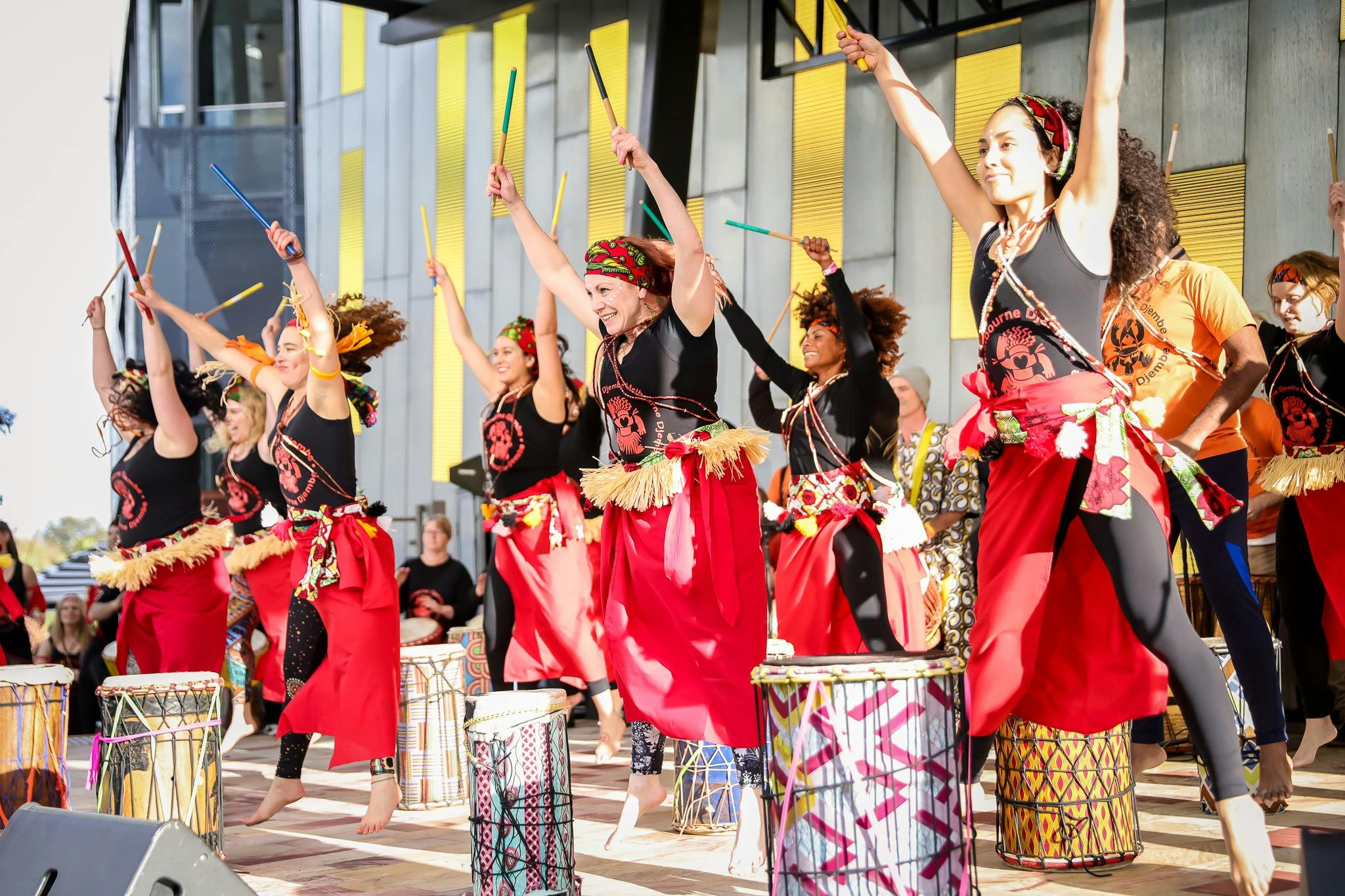 Brightly dressed performers beat drums for the annual Buddha's Day and Multicultural Festival.