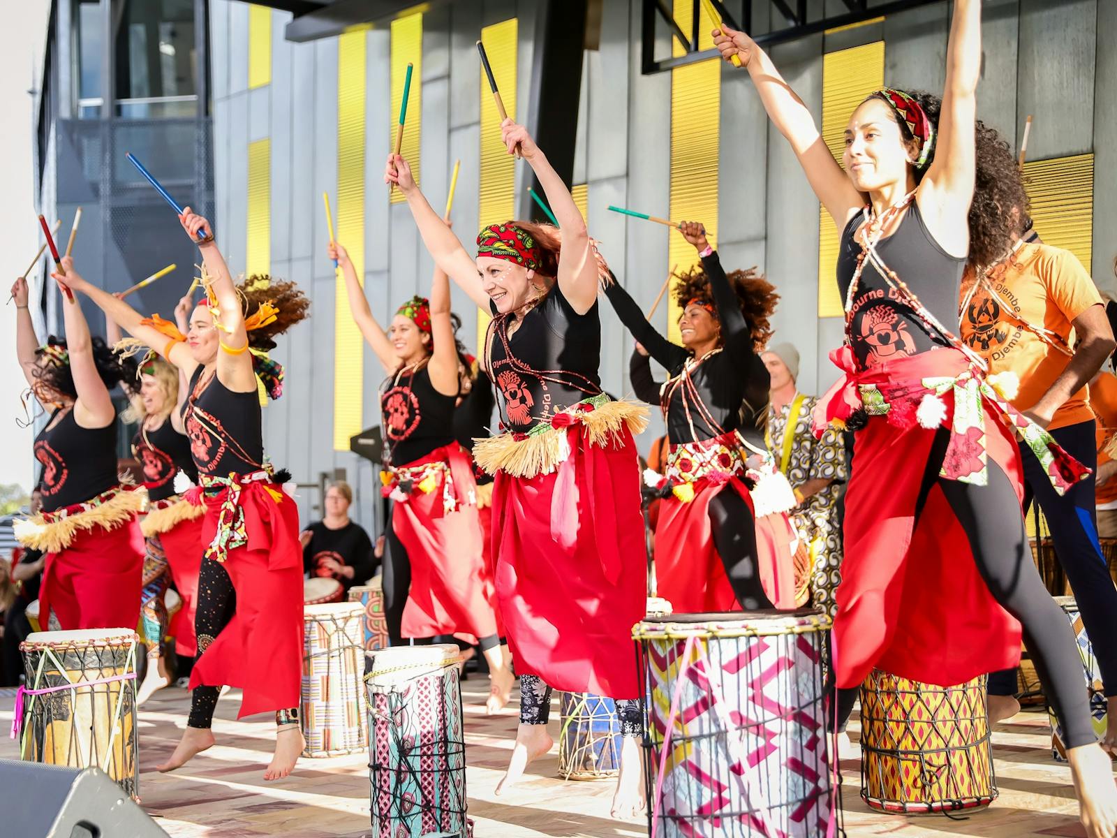 Brightly dressed performers beat drums for the annual Buddha's Day and Multicultural Festival.