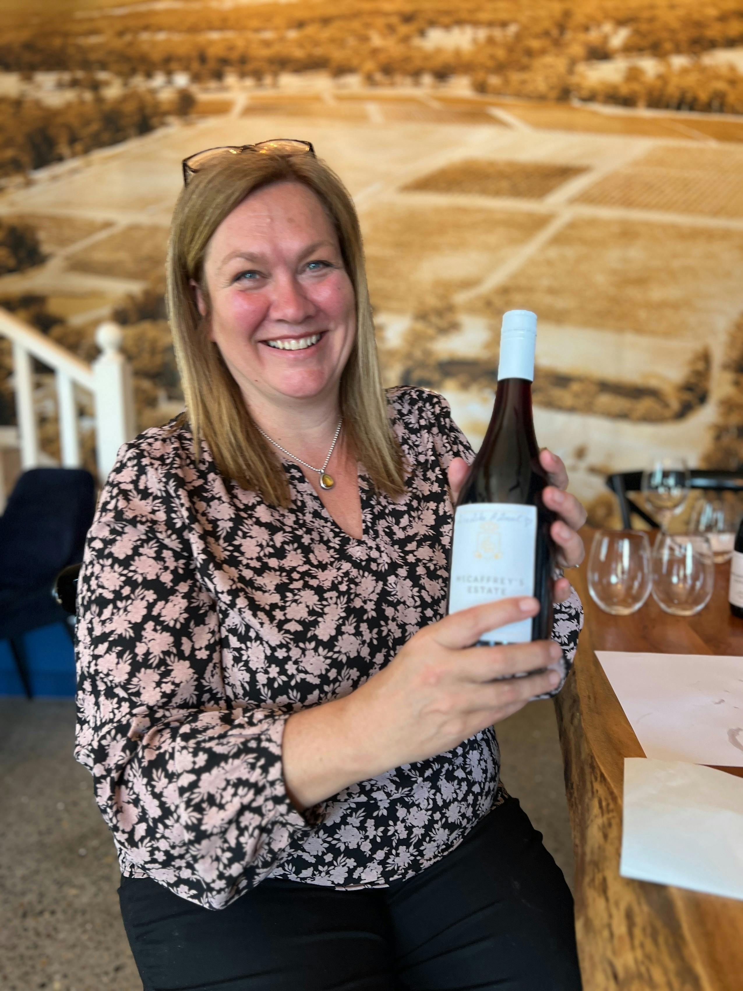 Customer with bottle of wine