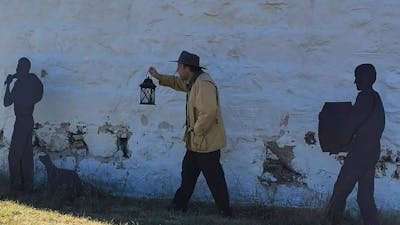 Man holding an oil lamp