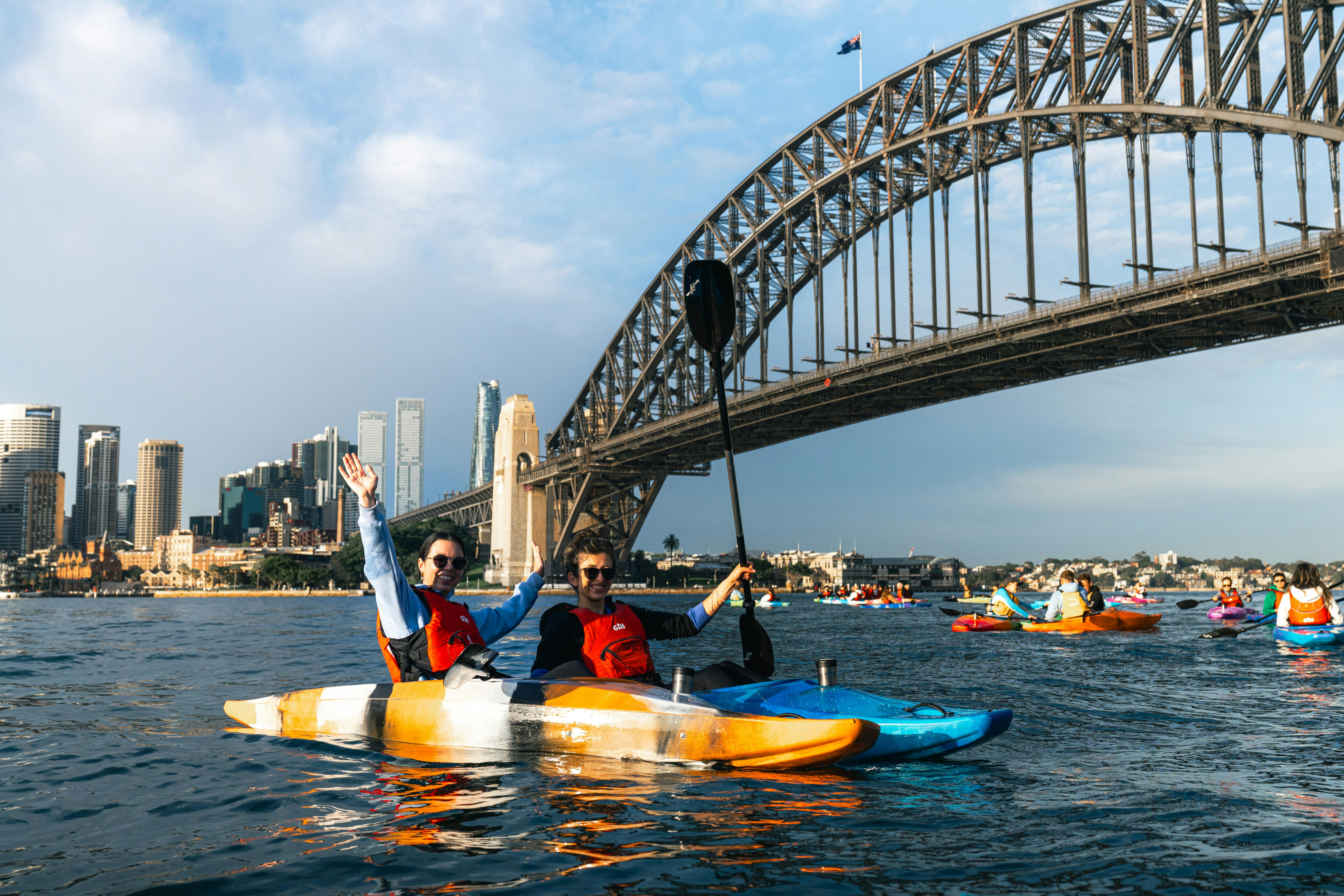 Sydney By Kayak provides customers with high res photos after paddling below Sydney Harbour Bridge.