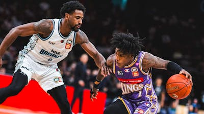 Sydney Kings player and opponent on court