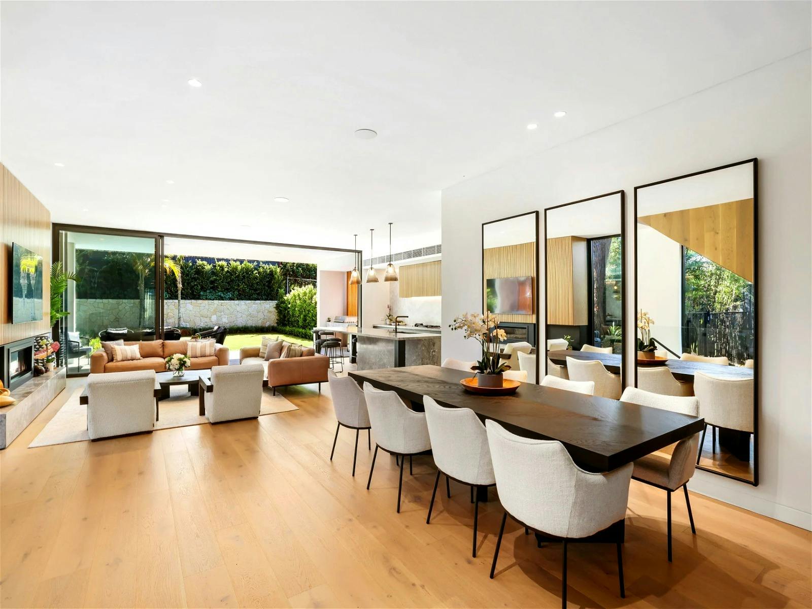 gorgeous lounge area with fireplace and dining area where you’ll enjoy meals shared with loved ones