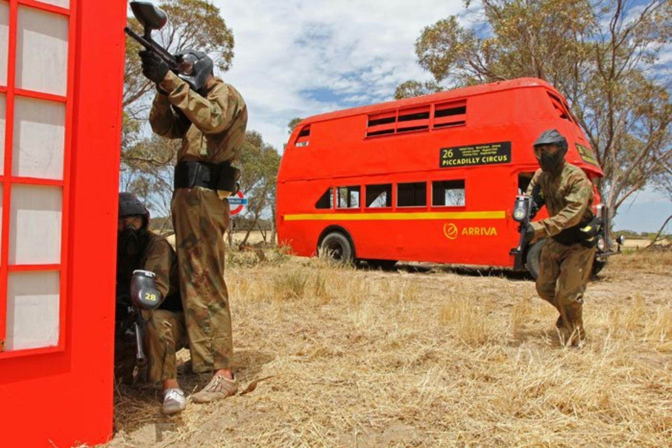 Three men in a game of paintball
