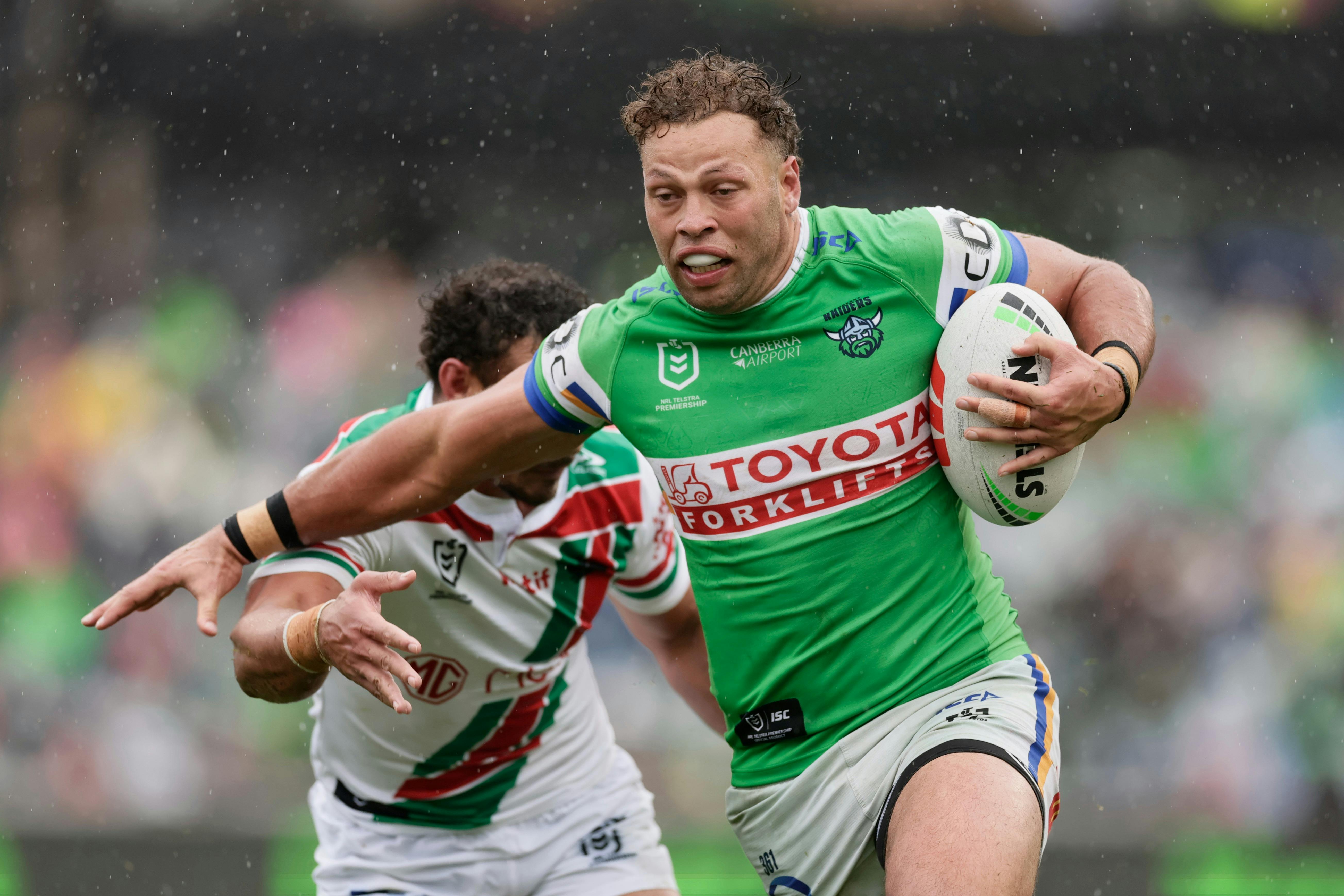 Canberra Raiders player Sebastian Kris running the ball.