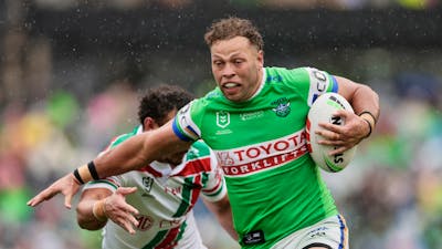 Canberra Raiders player Sebastian Kris running the ball.