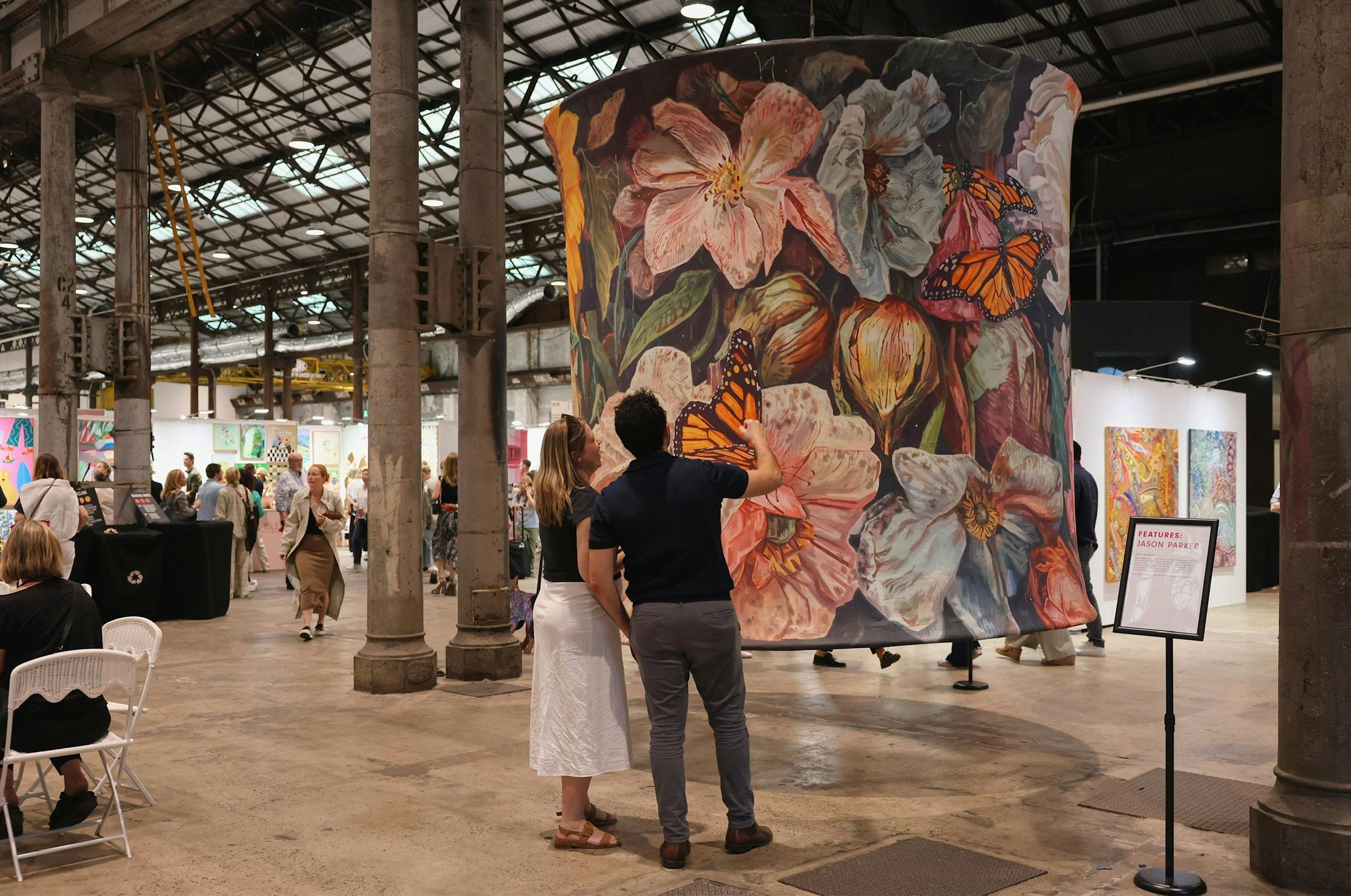 Attendees viewing artwork